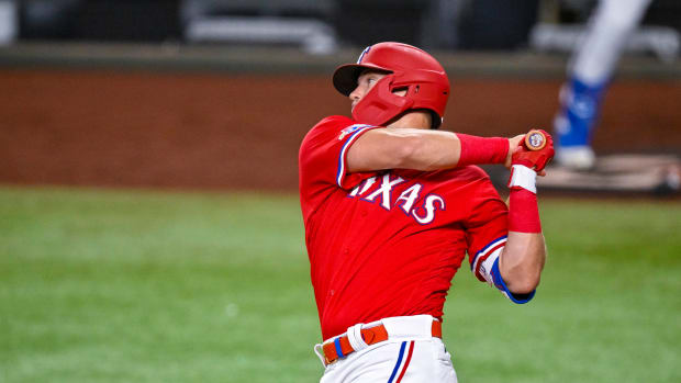 Sep 9, 2022; Arlington, Texas, USA; Texas Rangers third baseman Josh Jung (6) hits a single against the Toronto Blue Jays during the seventh inning at Globe Life Field. Mandatory Credit: Jerome Miron-USA TODAY Sports